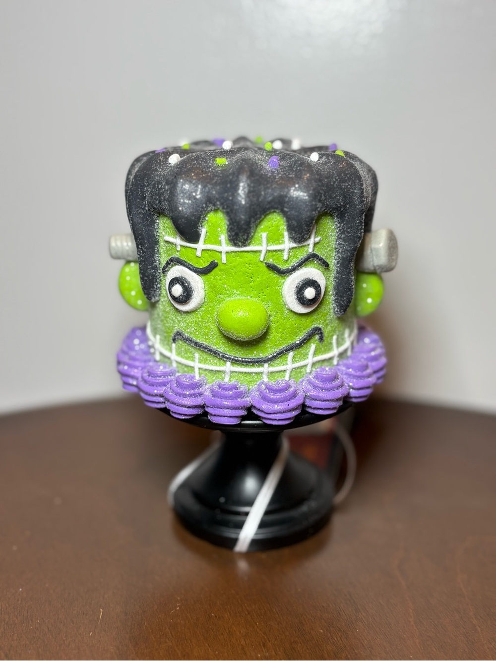 Green Frankenstein Figure with Purple Accents